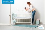 AeroSleep babyroom AM EV 120 060 fitted sheet with model holding baby 1